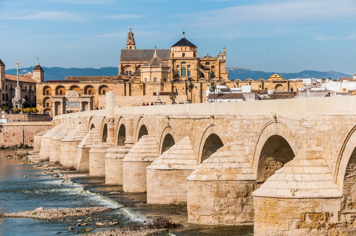 'View of Great Mosque of Cordoba across famous Roman Bridge' - Andalusia